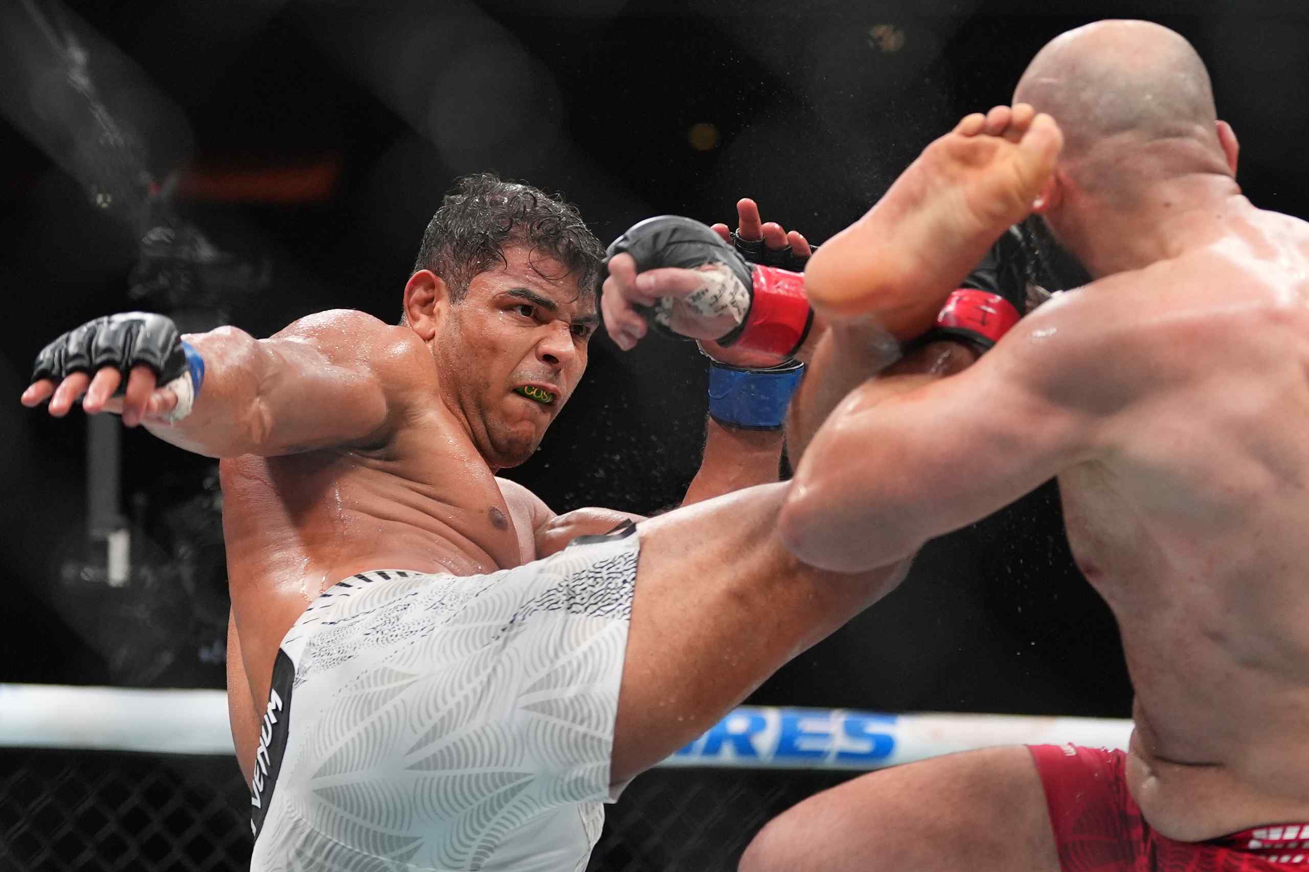 Paulo Costa, left, of Brazil, fights Azamat Murzakanov, of Russia, in a light heavyweight bout at a UFC 327