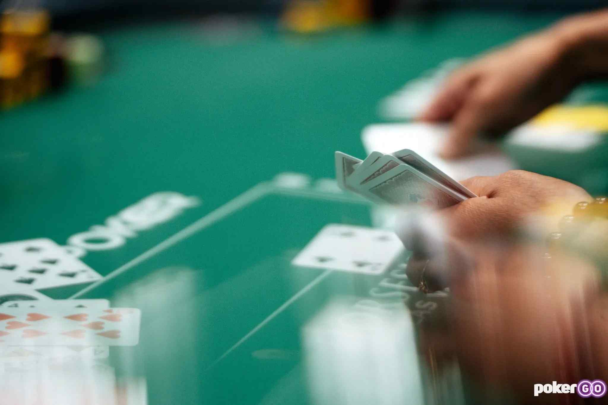Poker hands being dealt