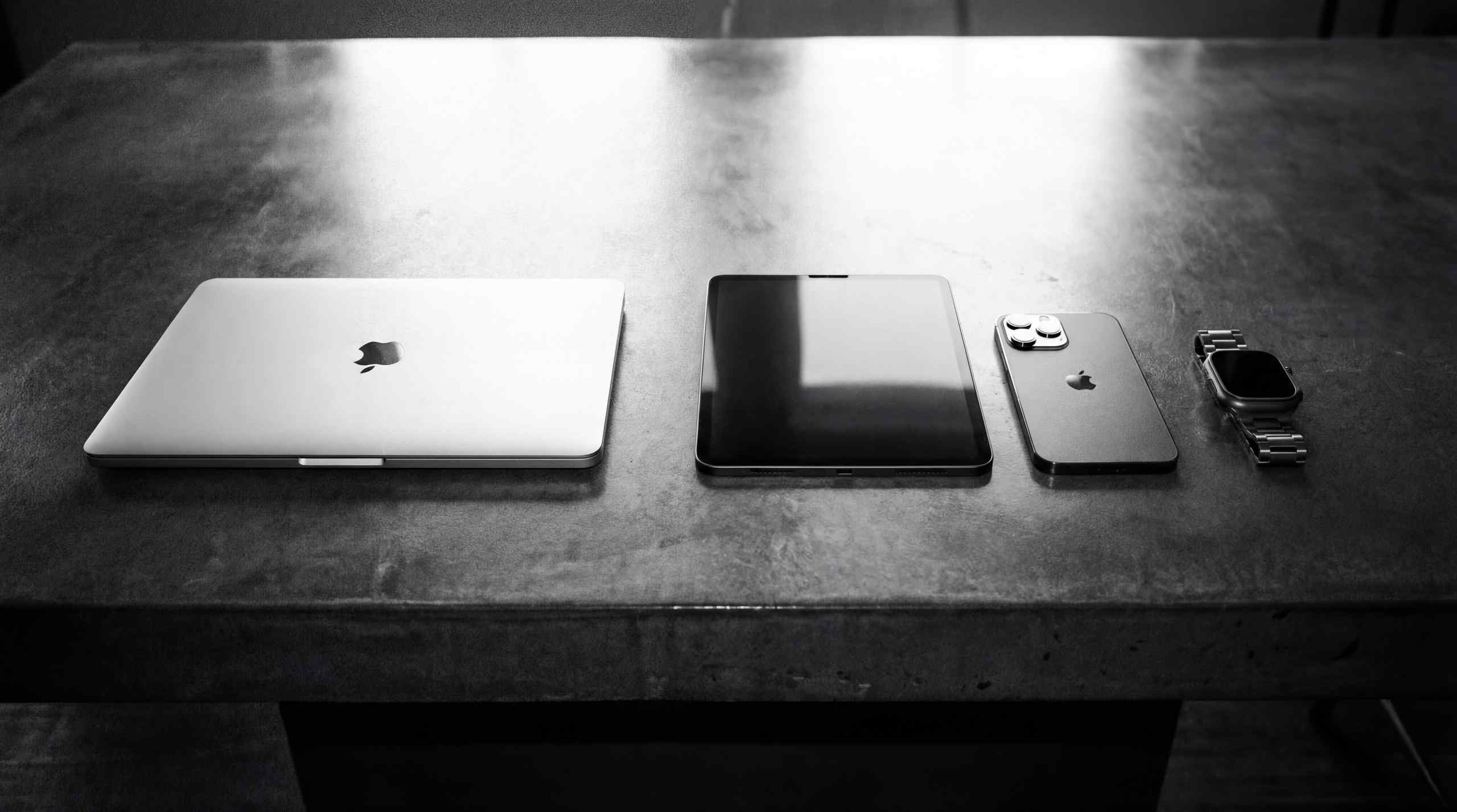 A laptop, tablet, and mobile device all relevant to prediction market platforms